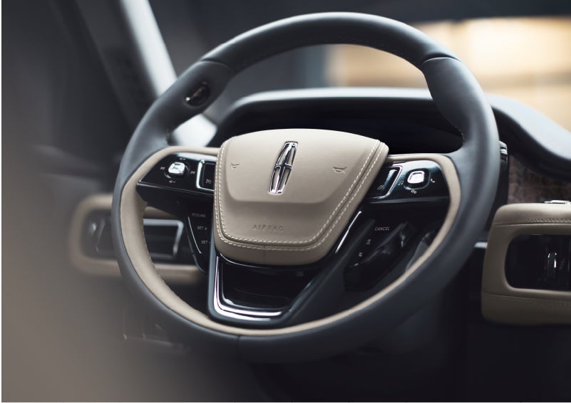 The intuitively placed controls of the steering wheel on a 2023 Lincoln Aviator® SUV | Boulevard Lincoln in Georgetown DE