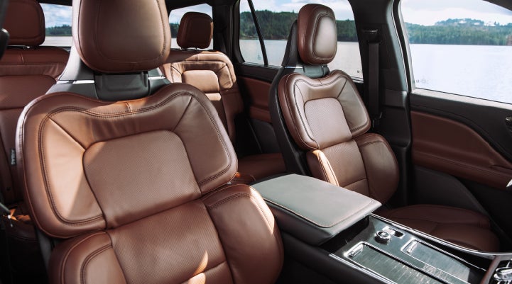 The front row's Perfect Position Seats in a 2024 Lincoln Aviator® Reserve model with Ebony Roast interior | Boulevard Lincoln in Georgetown DE