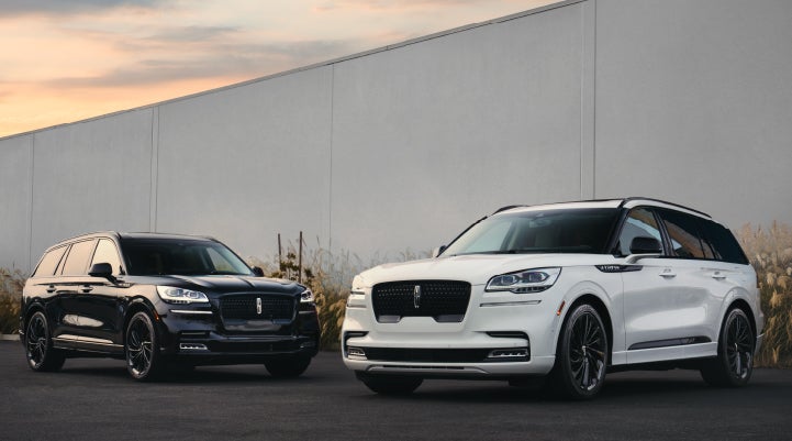 Two Lincoln Aviator® SUVs are shown with the available Jet Appearance Package | Boulevard Lincoln in Georgetown DE