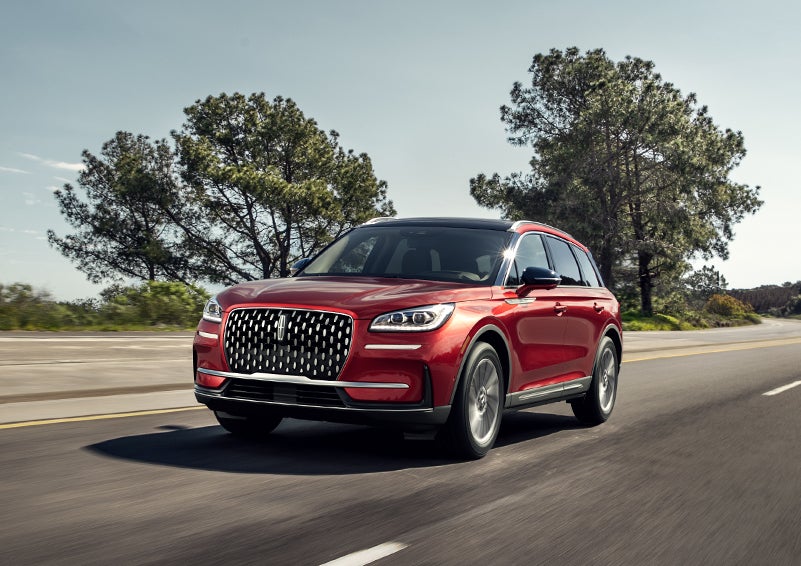A 2024 Lincoln Corsair® SUV is shown being driven on a country road. | Boulevard Lincoln in Georgetown DE