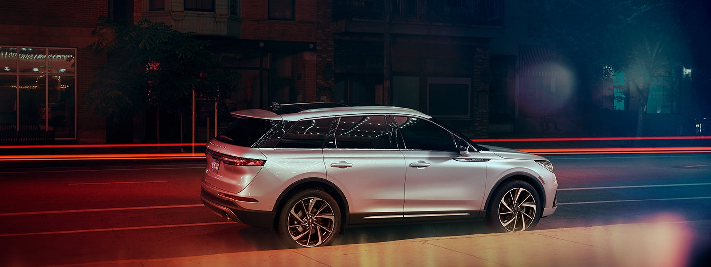 The 2024 Lincoln Corsair® SUV is parked on a city street at night. | Boulevard Lincoln in Georgetown DE